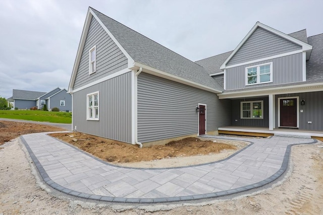 40 Blood Rd, Charlton, MA 01507 - view of front of property with a porch, a shingled roof, and board and batten siding