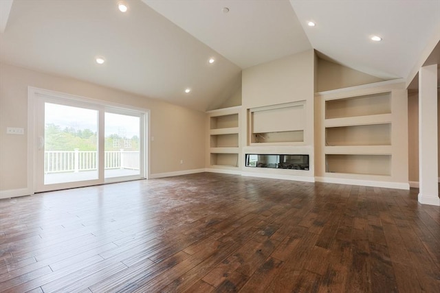40 Blood Rd, Charlton, MA 01507 - unfurnished living room with built in features, dark wood-style flooring, lofted ceiling, a glass covered fireplace, and recessed lighting