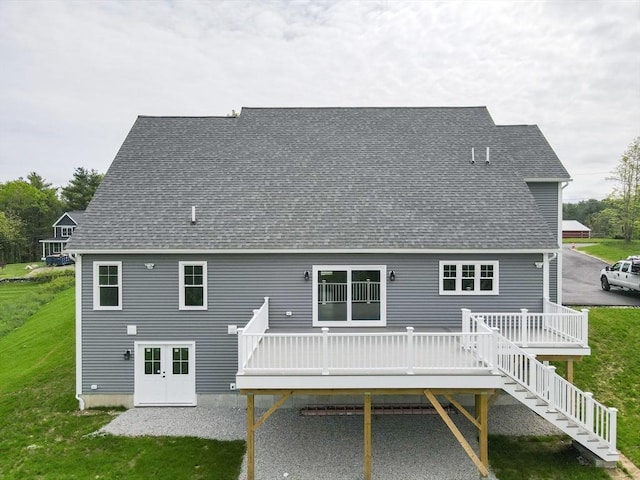 40 Blood Rd, Charlton, MA 01507 - back of property featuring a deck, a lawn, roof with shingles, and stairway