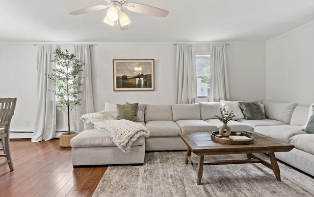 37 Saint Michaels Ave, Somerset, MA 02726 - living area featuring wood finished floors, ornamental molding, a ceiling fan, and baseboard heating