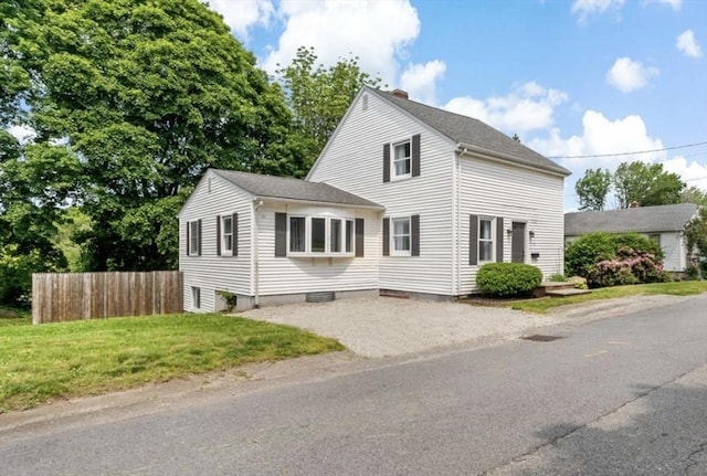 37 Saint Michaels Ave, Somerset, MA 02726 - view of front of home with asphalt driveway, a chimney, and roof with shingles