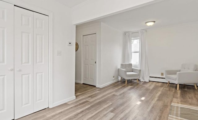37 Saint Michaels Ave, Somerset, MA 02726 - sitting room featuring light wood finished floors, a baseboard heating unit, and baseboards