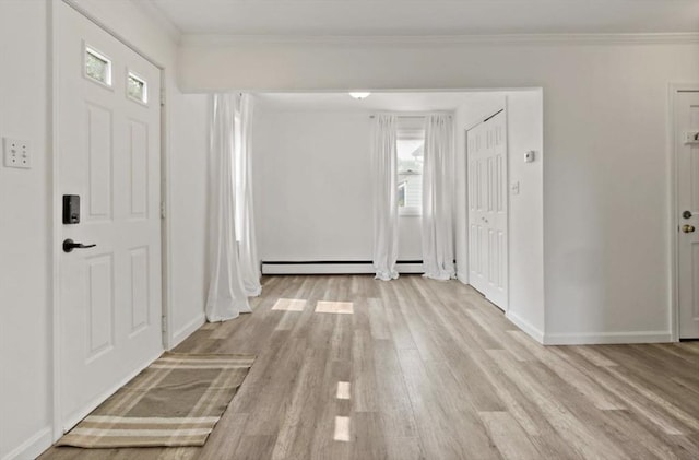 37 Saint Michaels Ave, Somerset, MA 02726 - entrance foyer with light wood-type flooring, ornamental molding, baseboards, and a baseboard heating unit