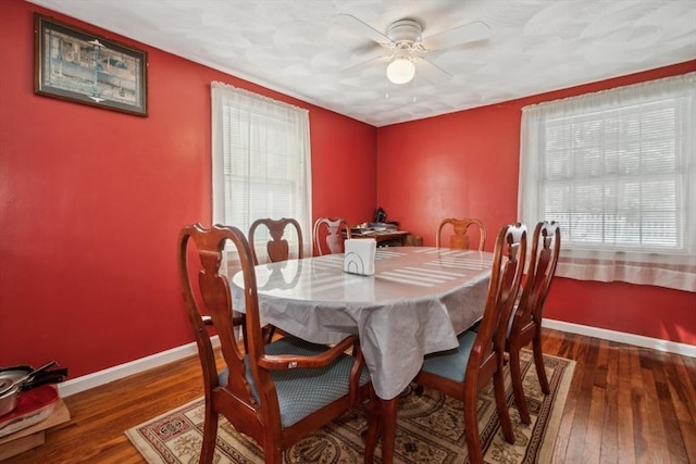 dining room featuring dark wood-type flooring and ceiling fan