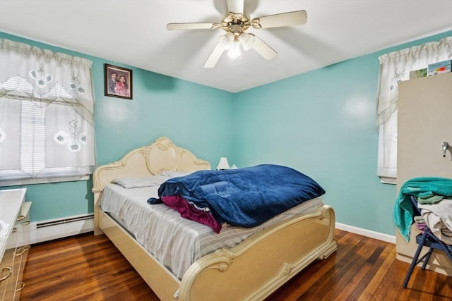 bedroom featuring dark wood-type flooring, a baseboard radiator, and ceiling fan