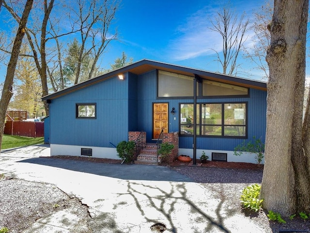 back of property featuring crawl space