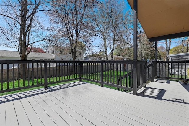 deck featuring a yard and a fenced backyard