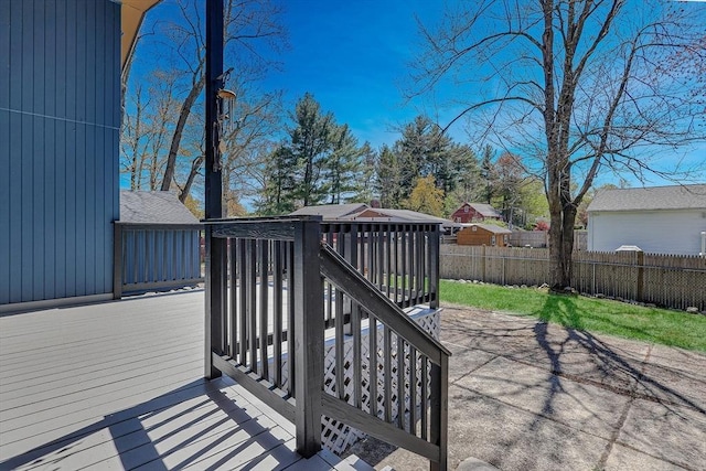 wooden terrace featuring fence
