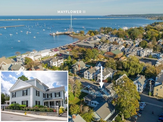 birds eye view of property with a water view and a residential view