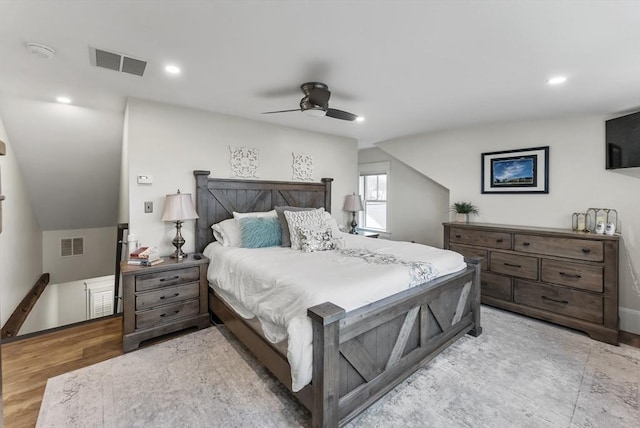 bedroom featuring light wood-type flooring, ceiling fan, visible vents, and recessed lighting