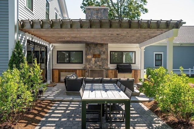 view of patio with an outdoor hangout area, grilling area, and a pergola