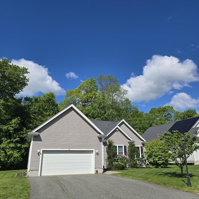 51 Alexandras Way, Brockton, MA 02301 - view of front of home featuring driveway, a front yard, and an attached garage