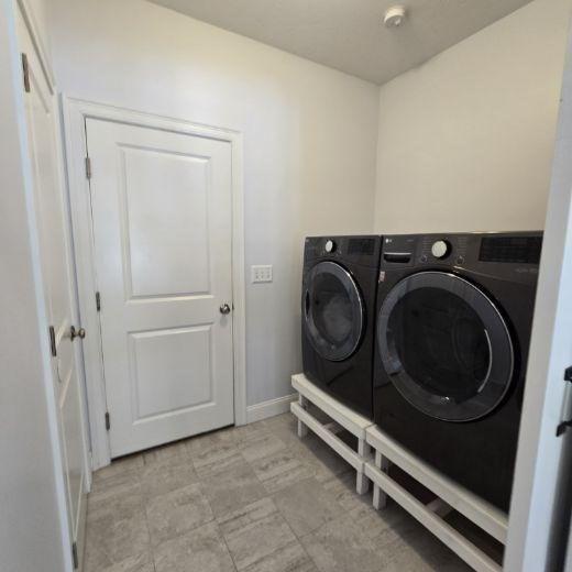51 Alexandras Way, Brockton, MA 02301 - laundry area with washer and dryer and baseboards