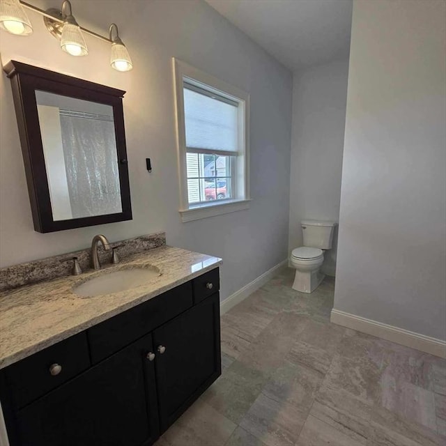 51 Alexandras Way, Brockton, MA 02301 - bathroom with baseboards, vanity, toilet, and a shower with shower curtain
