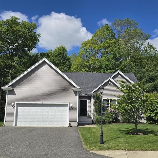 51 Alexandras Way, Brockton, MA 02301 - single story home with asphalt driveway, a front yard, and an attached garage