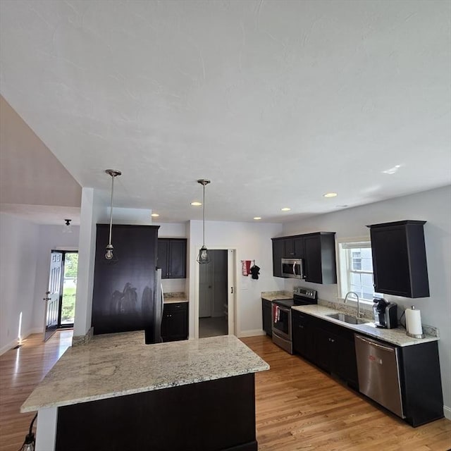 51 Alexandras Way, Brockton, MA 02301 - kitchen featuring stainless steel appliances, a sink, light wood finished floors, dark cabinets, and baseboards