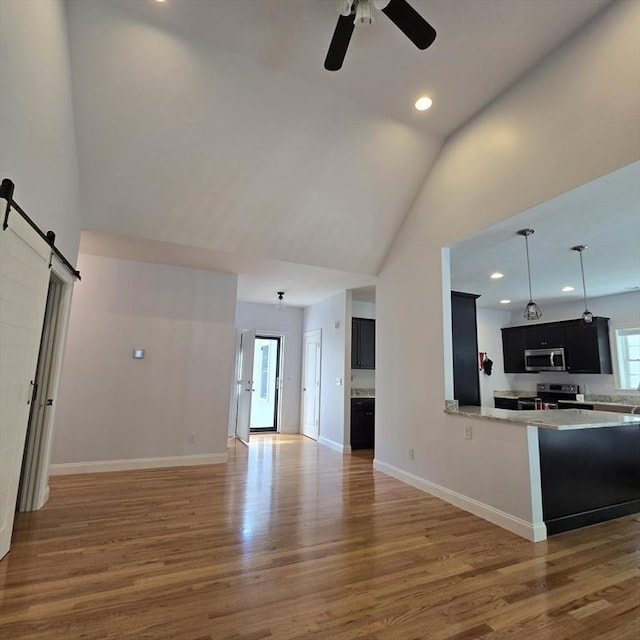 51 Alexandras Way, Brockton, MA 02301 - unfurnished living room featuring ceiling fan, wood finished floors, recessed lighting, baseboards, and high vaulted ceiling