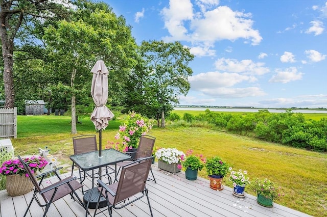 16 Gulls Cove Rd, Yarmouth, MA 02673 - wooden terrace with a lawn and outdoor dining space