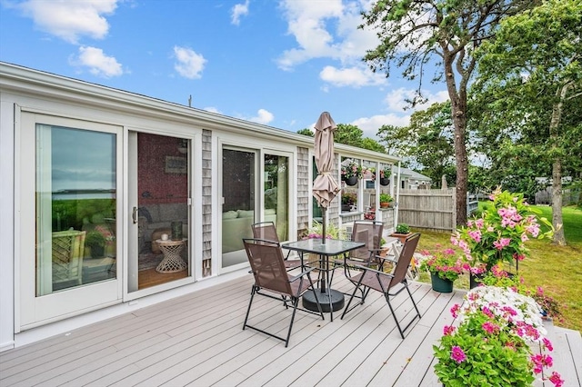 16 Gulls Cove Rd, Yarmouth, MA 02673 - wooden terrace with outdoor dining space