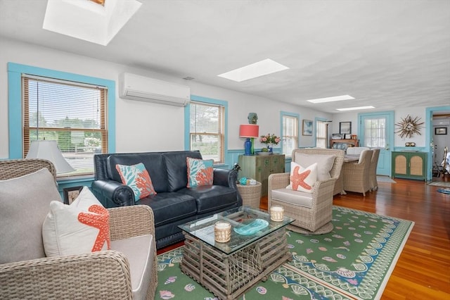 16 Gulls Cove Rd, Yarmouth, MA 02673 - living room with a skylight, an AC wall unit, and healthy amount of natural light