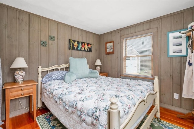 16 Gulls Cove Rd, Yarmouth, MA 02673 - bedroom with wood finished floors and wooden walls