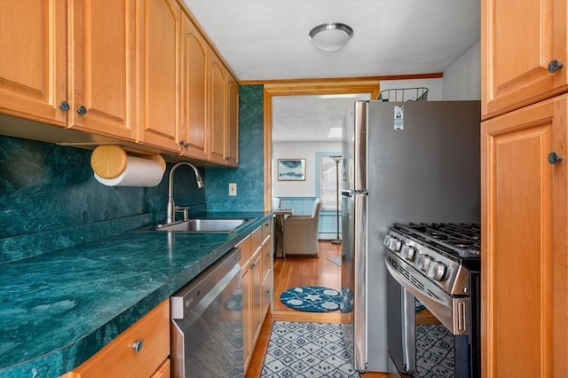 16 Gulls Cove Rd, Yarmouth, MA 02673 - kitchen featuring appliances with stainless steel finishes, dark countertops, and tasteful backsplash