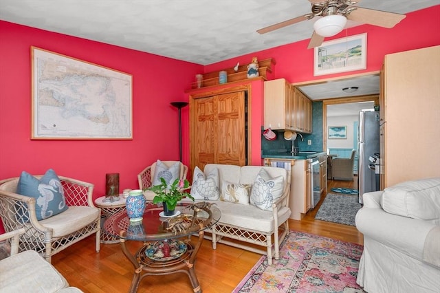 16 Gulls Cove Rd, Yarmouth, MA 02673 - living room with a ceiling fan and light wood-style floors