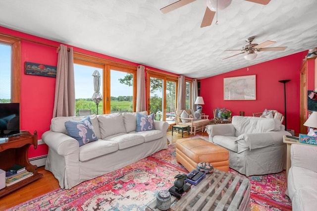 16 Gulls Cove Rd, Yarmouth, MA 02673 - living room featuring plenty of natural light, vaulted ceiling, ceiling fan, and wood finished floors