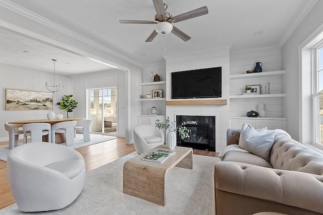 65 Palmetto Dr Unit 65, Bellingham, MA 02019 - living room featuring a ceiling fan, wood finished floors, ornamental molding, a fireplace, and built in shelves