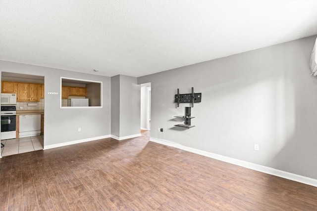 unfurnished living room with light hardwood / wood-style floors