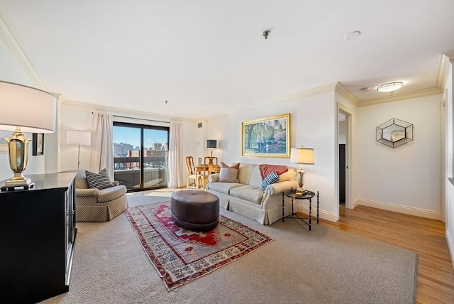 living room with light wood-type flooring and ornamental molding