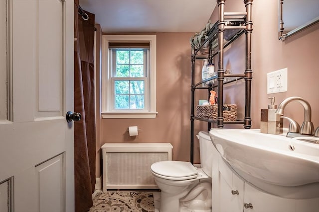 98 Moss St, New Bedford, MA 02744 - full bathroom with toilet, vanity, and radiator heating unit