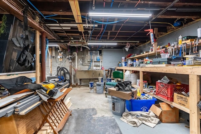 98 Moss St, New Bedford, MA 02744 - unfinished below grade area featuring a workshop area