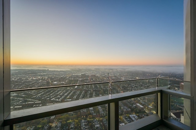 view of balcony at dusk