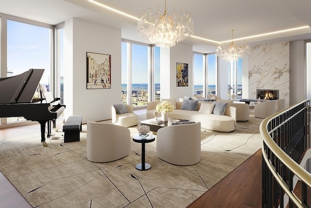 living room featuring an inviting chandelier, a high end fireplace, floor to ceiling windows, and light hardwood / wood-style floors