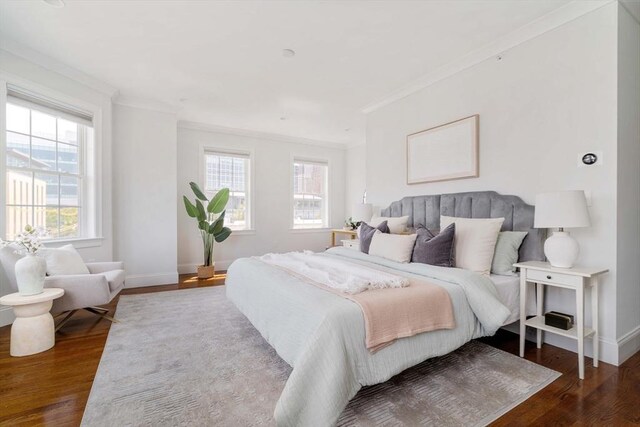 14 S Waverly St Unit 14, Boston, MA 02135 - bedroom featuring crown molding, wood finished floors, and baseboards