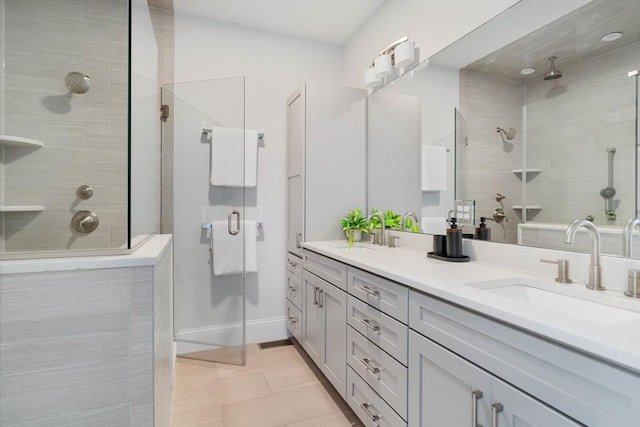 14 S Waverly St Unit 14, Boston, MA 02135 - bathroom with a stall shower, double vanity, tile patterned flooring, and baseboards
