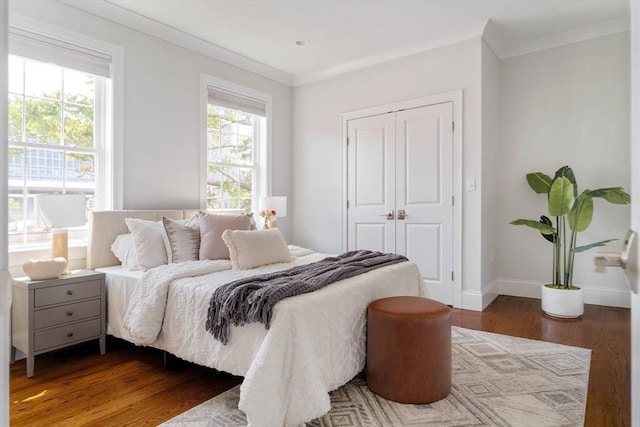 14 S Waverly St Unit 14, Boston, MA 02135 - bedroom with wood finished floors, a closet, crown molding, and baseboards