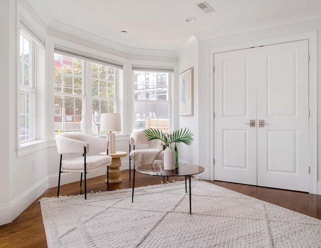 14 S Waverly St Unit 14, Boston, MA 02135 - sitting room with healthy amount of natural light, wood finished floors, baseboards, and crown molding