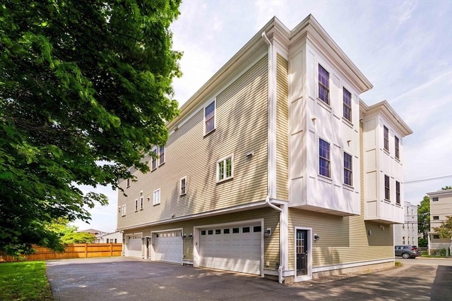14 S Waverly St Unit 14, Boston, MA 02135 - view of building exterior featuring driveway and a garage