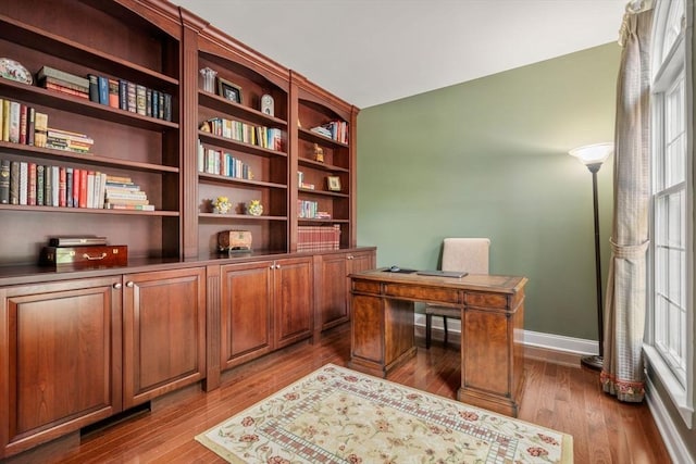 office area featuring wood finished floors and baseboards