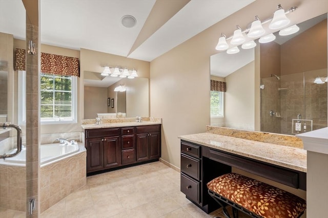 full bath with a stall shower, vaulted ceiling, tile patterned flooring, a bath, and vanity