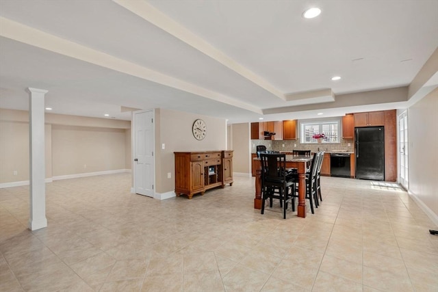 dining room featuring recessed lighting, baseboards, light tile patterned floors, and a raised ceiling