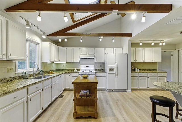 1 New Castle Rd, Ashland, MA 01721 - kitchen featuring white appliances, track lighting, a sink, under cabinet range hood, and white cabinets