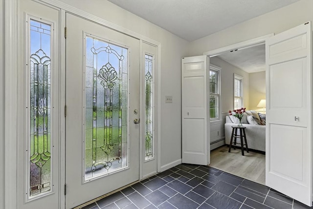 1 New Castle Rd, Ashland, MA 01721 - foyer entrance with baseboard heating and baseboards