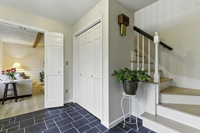 1 New Castle Rd, Ashland, MA 01721 - foyer entrance with stairway and baseboards