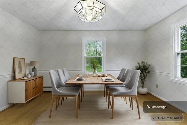 1 New Castle Rd, Ashland, MA 01721 - dining area featuring light wood-style floors, plenty of natural light, a chandelier, and baseboard heating