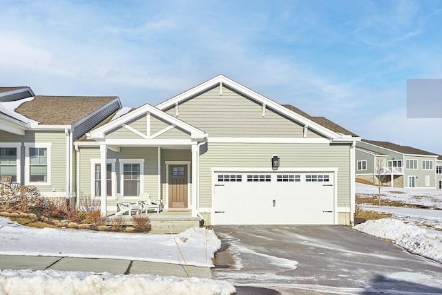 view of front of property featuring a garage and covered porch