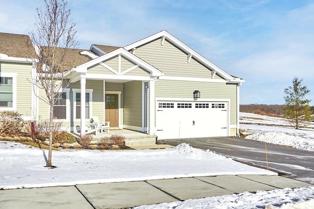 view of front of house featuring a garage and covered porch