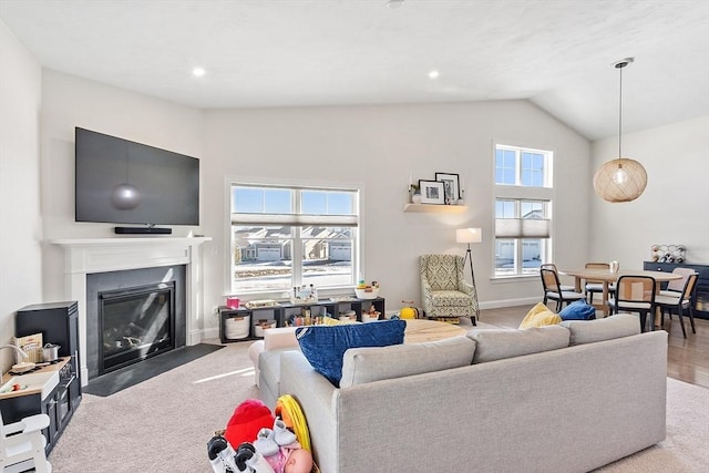 living room featuring lofted ceiling